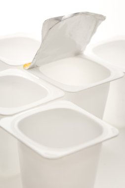 Empty crushed plastic yogurt pots clipart