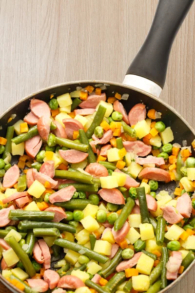 Vegetables with sausages fried — Stock Photo, Image