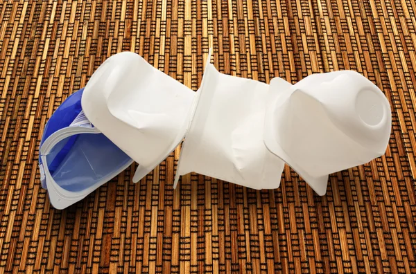 Empty crushed plastic yogurt pots — Stock Photo, Image