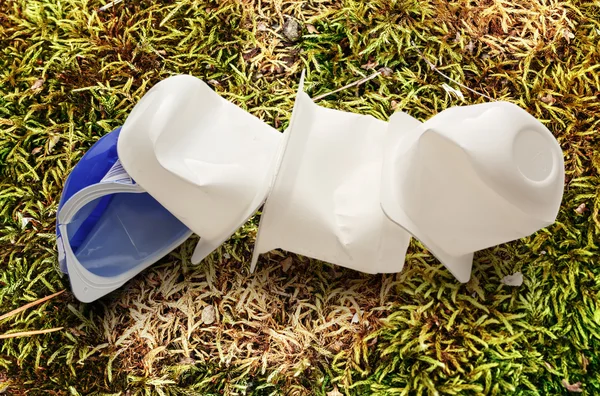 Empty crushed plastic yogurt pots — Stock Photo, Image