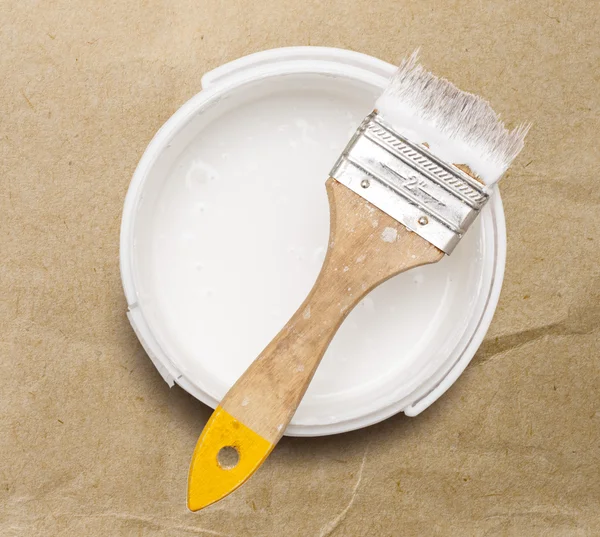 Can of white paint with brush — Stock Photo, Image