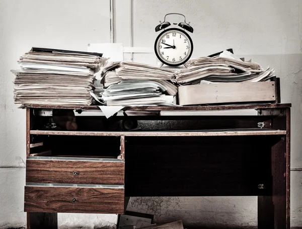 Messy workplace and alarm clock — Stock Photo, Image