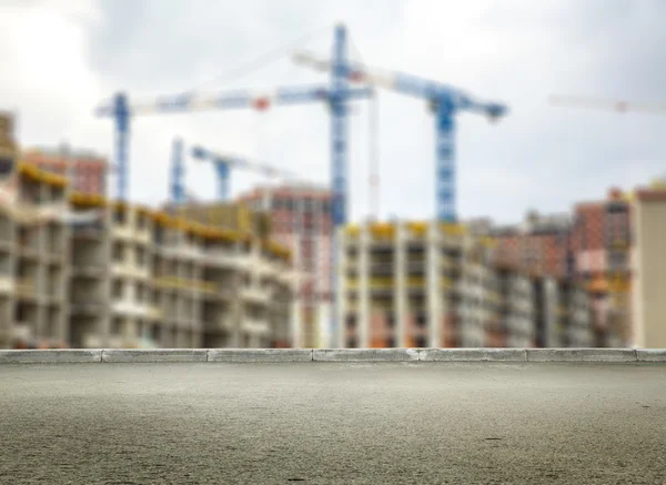 Gebäude im Bau und Kräne — Stockfoto