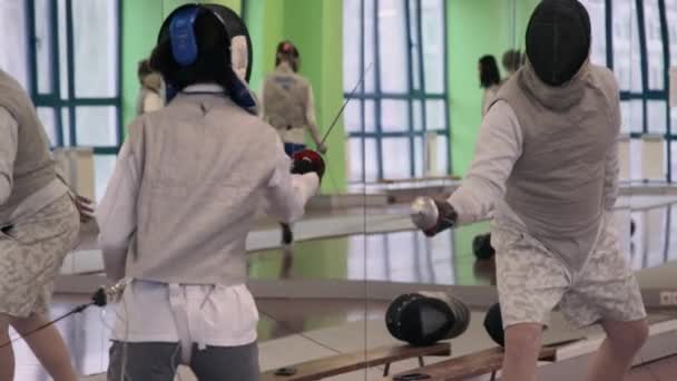 Fencing coach working with his student — Stock Video