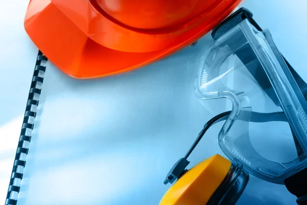 Goggles, earphones and red helmet — Stock Photo, Image