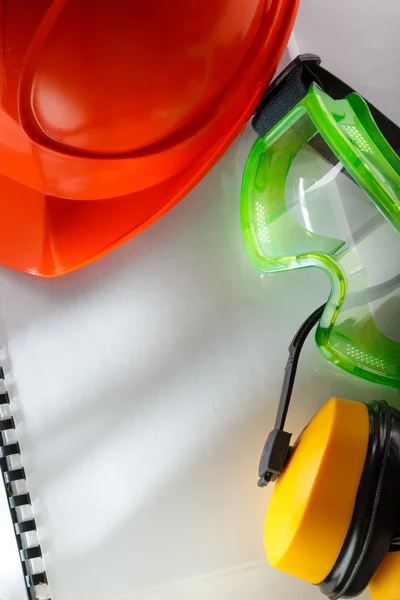 Safety goggles, earphones and helmet — Stock Photo, Image