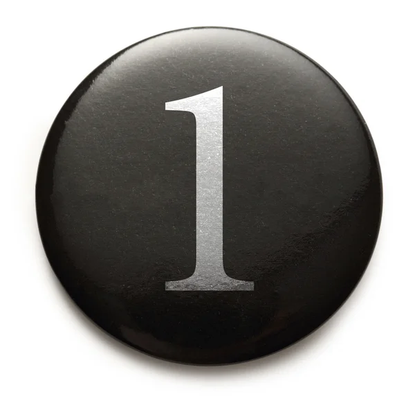 Número blanco 1 en insignia negra —  Fotos de Stock