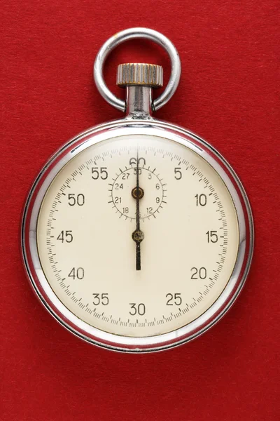 Stopwatch op rood papier — Stockfoto