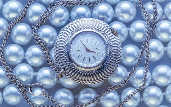 Watch on blue pearl — Stock Photo, Image