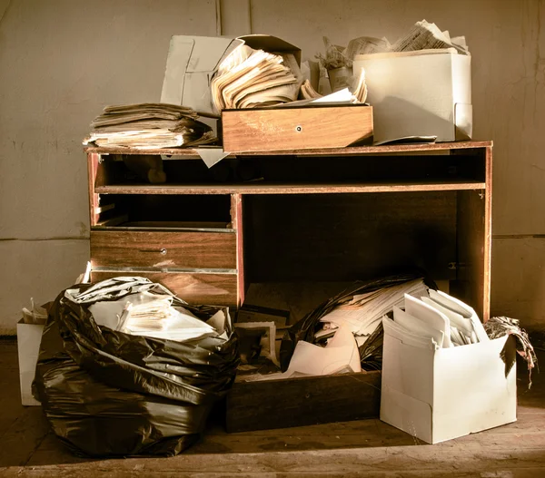 Table and stack of paper — Stock Photo, Image