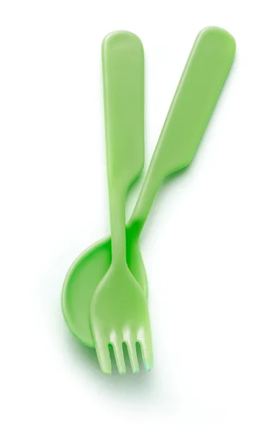 Green plastic tableware spoon and fork — Stock Photo, Image