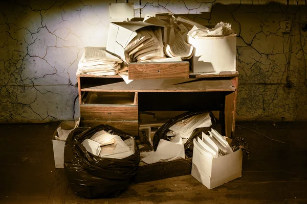 Table and stack of paper — Stock Photo, Image