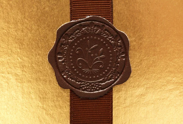 Leather seal on ribbon — Stock Photo, Image