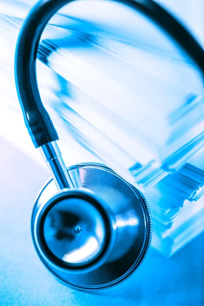 Stethoscope and heap of paper cards — Stock Photo, Image