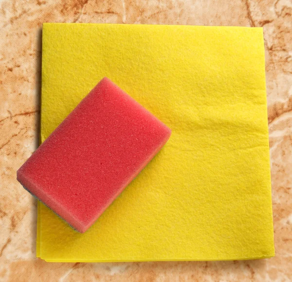 Yellow duster and red sponge — Stock Photo, Image