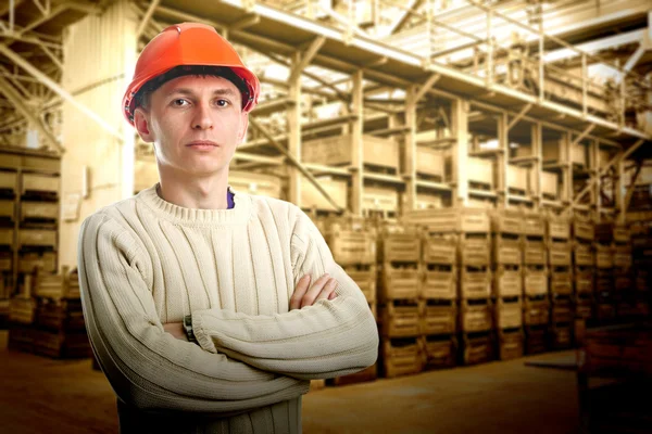 Workman in big storage room — Stock Photo, Image