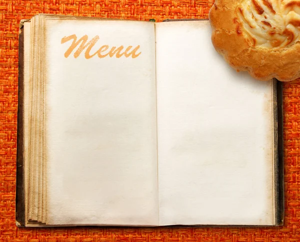 Menu book with cake — Stock Photo, Image