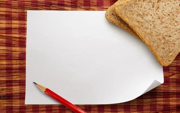 Blank paper with bread — Stock Photo, Image