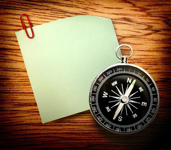 Blank green sticker and compass — Stock Photo, Image