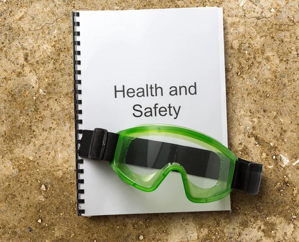 Health and safety register with goggles — Stock Photo, Image