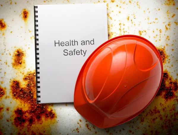 Health and safety register with helmet — Stock Photo, Image