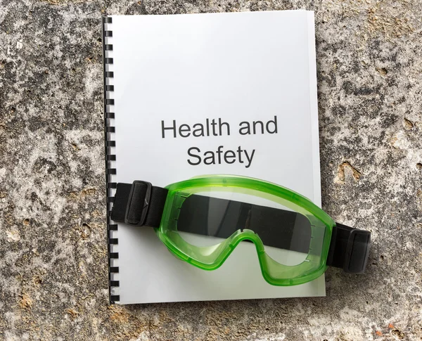 Health and safety register with goggles — Stock Photo, Image