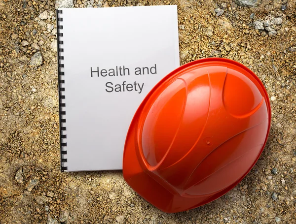 Health and safety register with helmet — Stock Photo, Image