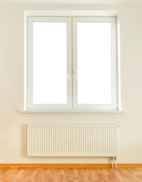 White plastic double window and radiator — Stock Photo, Image