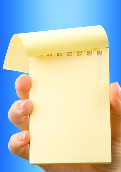 Hand holding notepad — Stock Photo, Image