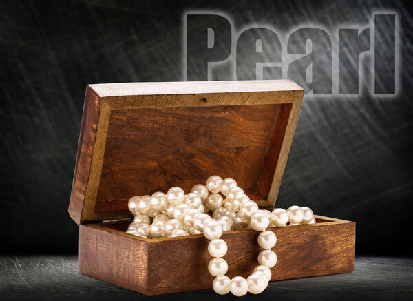 chest with white pearl necklace