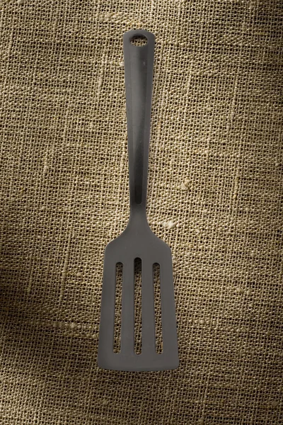 Black plastic spatula — Stock Photo, Image