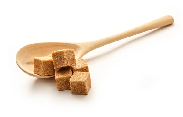 Cukier trzcinowy z drewnianą łyżką — Zdjęcie stockowe