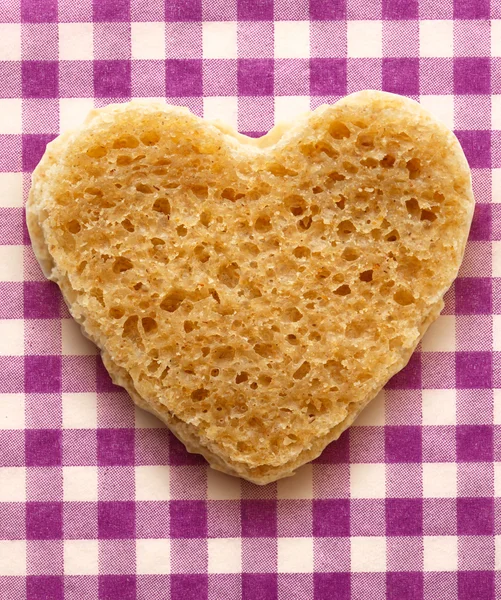 Slice of bread in heart form — Stock Photo, Image