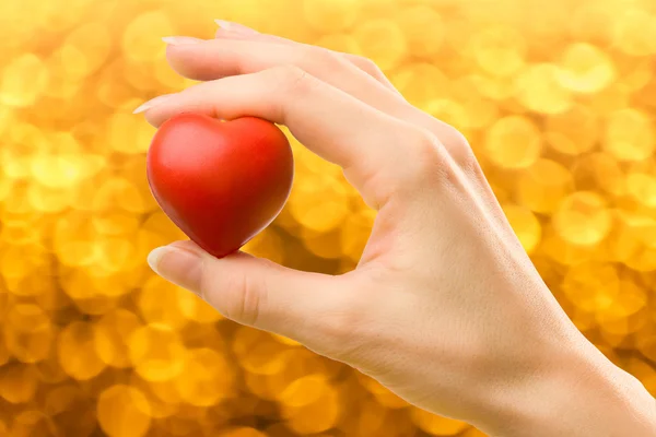 Female hand with red heart — Stock Photo, Image