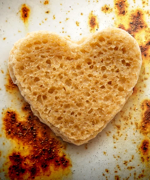 Slice of bread in heart form — Stock Photo, Image