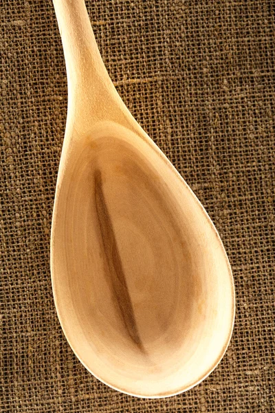 Wooden spoon on sack — Stock Photo, Image