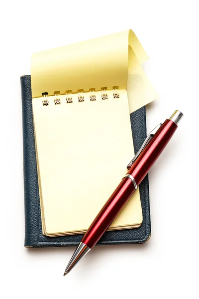 Yellow blank notepad with pen — Stock Photo, Image