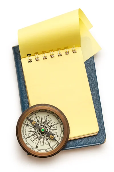 Vintage compass and notepad — Stock Photo, Image