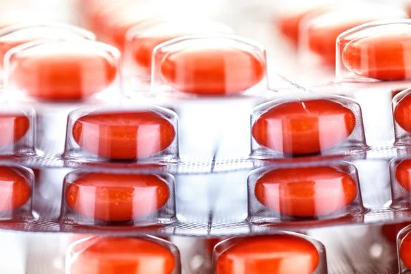 Red tablets in plastic packing — Stock Photo, Image