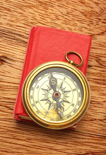 Red book with retro compass — Stock Photo, Image