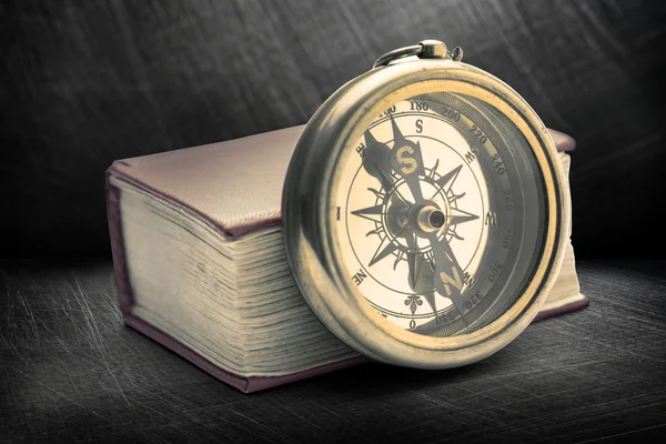 Red book with retro compass — Stock Photo, Image