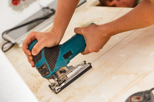 Installing new hob in modern kitchen