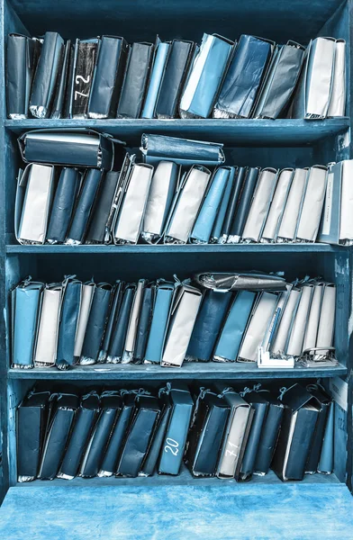 Paper documents stacked on shelves — Stock Photo, Image