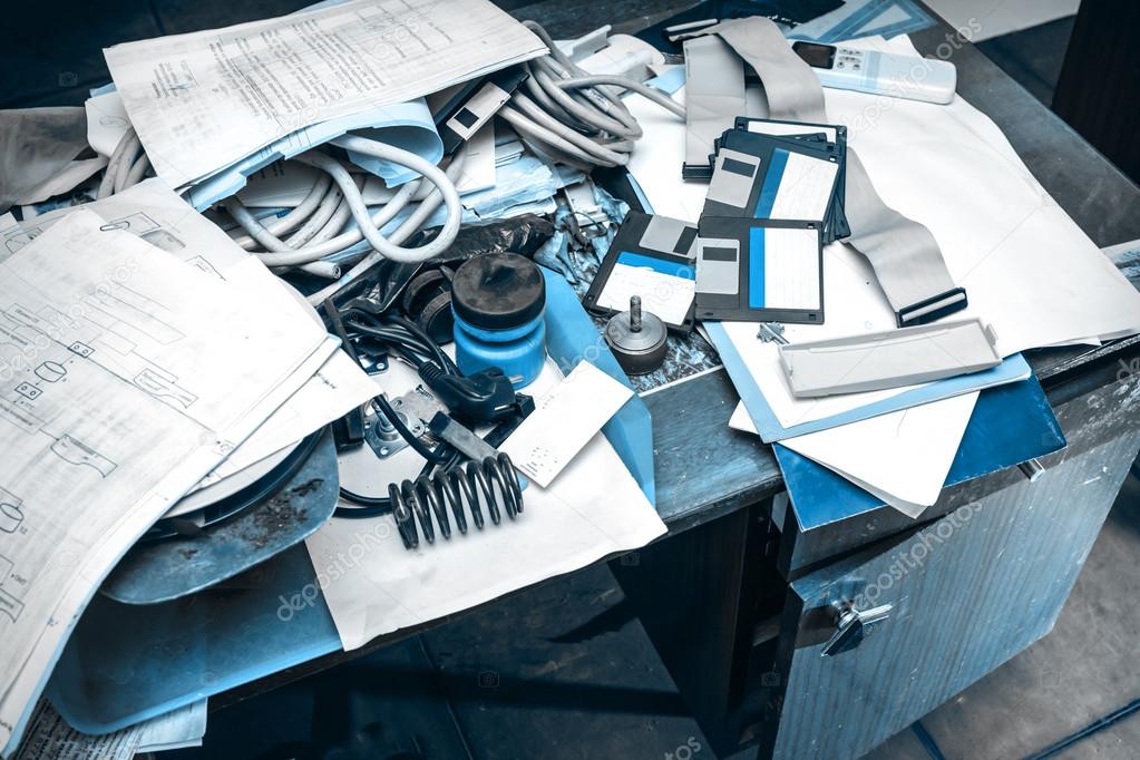 Messy workplace with paper on table