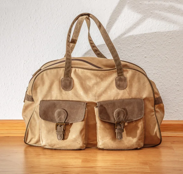 Bag on wooden floor — Stock Photo, Image