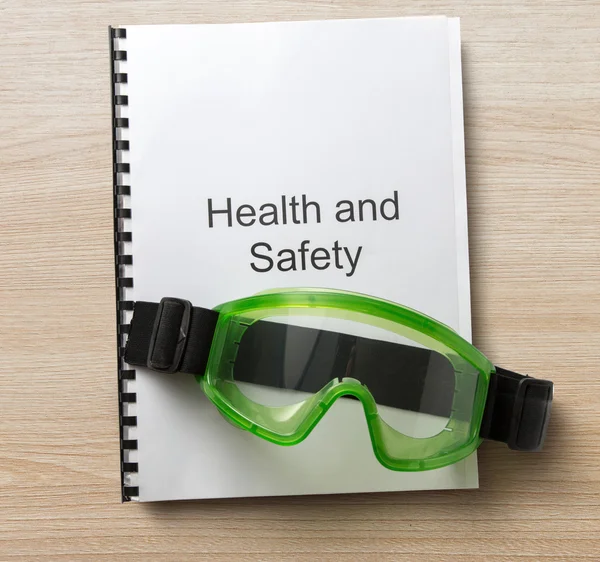 Health and safety register with goggles — Stock Photo, Image