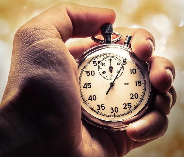 Male hand holding stopwatch — Stock Photo, Image