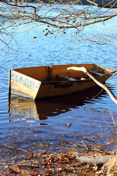 old boat drifting on the lake