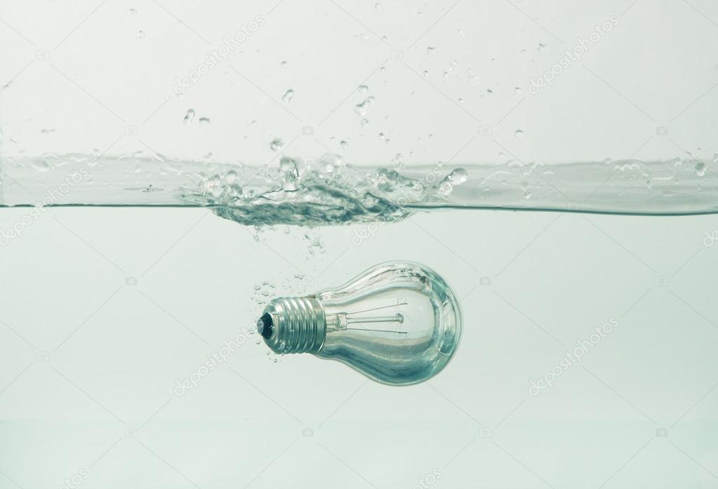 Throwing light bulbs in the aquarium — Stock Photo © dragi52 111807110
