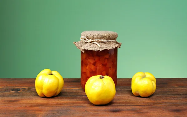 Fresh quince jam in a jar and glass — Stock Photo, Image